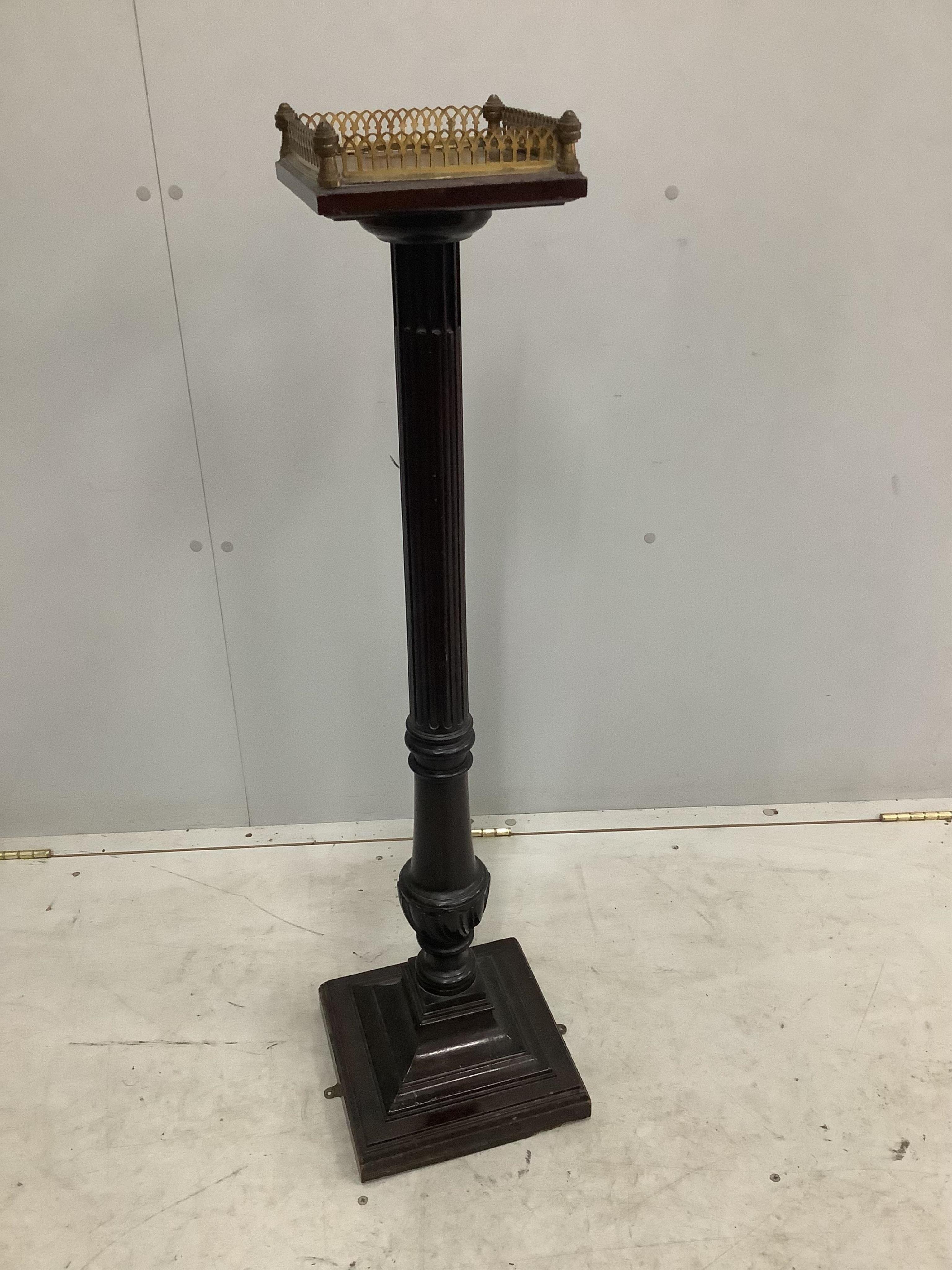 An Edwardian mahogany pedestal with brass galleried top, height 102cm. Condition - fair